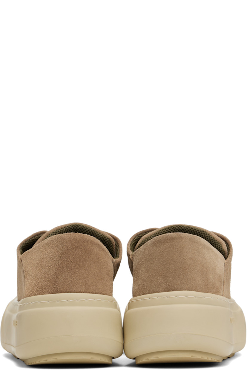 Low-top suede sneakers in brown. 

· Lace-up closure
· Padded tongue and collar
· Logo stamp at padded footbed
· Mesh lining
· Topstitching at welt
· Logo embossed at rubber platform midsole
· Treaded rubber sole
· Platform: H2"

Supplier color: Cappuccino suede