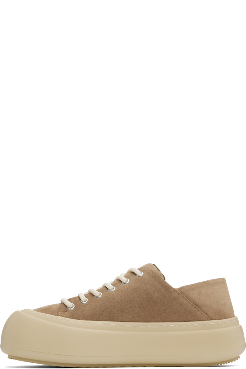 Low-top suede sneakers in brown. 

· Lace-up closure
· Padded tongue and collar
· Logo stamp at padded footbed
· Mesh lining
· Topstitching at welt
· Logo embossed at rubber platform midsole
· Treaded rubber sole
· Platform: H2"

Supplier color: Cappuccino suede