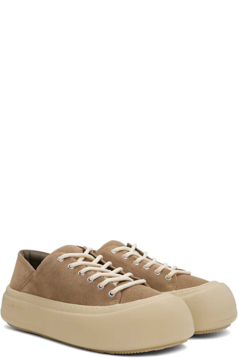Low-top suede sneakers in brown. 

· Lace-up closure
· Padded tongue and collar
· Logo stamp at padded footbed
· Mesh lining
· Topstitching at welt
· Logo embossed at rubber platform midsole
· Treaded rubber sole
· Platform: H2"

Supplier color: Cappuccino suede