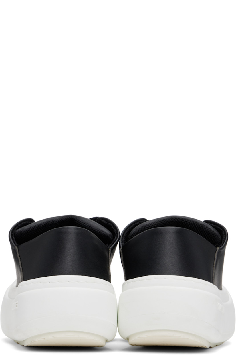 Low-top buffed faux-leather sneakers in black.

· Lace-up closure
· Padded tongue and collar
· Logo stamp at padded footbed
· Mesh and grained faux-leather lining
· Topstitching at welt
· Logo embossed at rubber platform midsole
· Treaded rubber sole
· Platform: H2"

Supplier color: Black