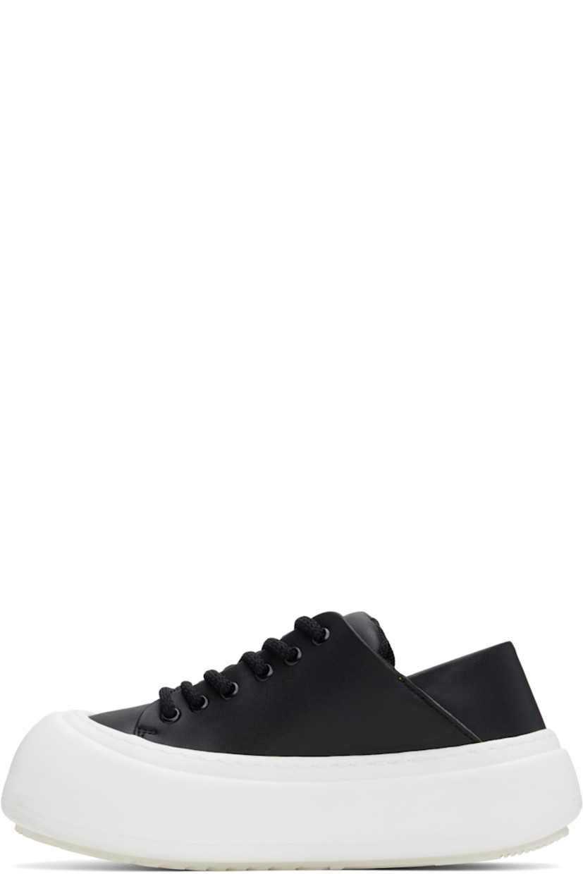 Low-top buffed faux-leather sneakers in black.

· Lace-up closure
· Padded tongue and collar
· Logo stamp at padded footbed
· Mesh and grained faux-leather lining
· Topstitching at welt
· Logo embossed at rubber platform midsole
· Treaded rubber sole
· Platform: H2"

Supplier color: Black