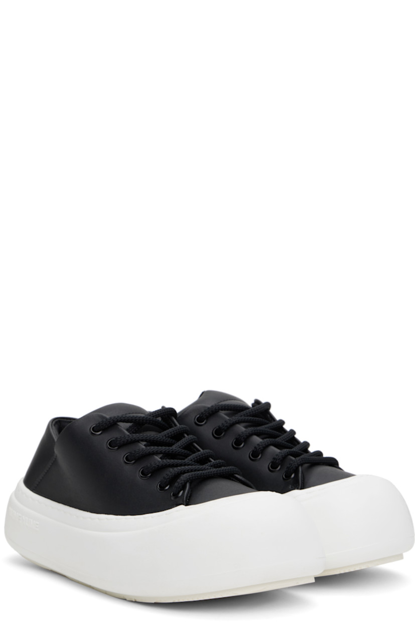 Low-top buffed faux-leather sneakers in black.

· Lace-up closure
· Padded tongue and collar
· Logo stamp at padded footbed
· Mesh and grained faux-leather lining
· Topstitching at welt
· Logo embossed at rubber platform midsole
· Treaded rubber sole
· Platform: H2"

Supplier color: Black