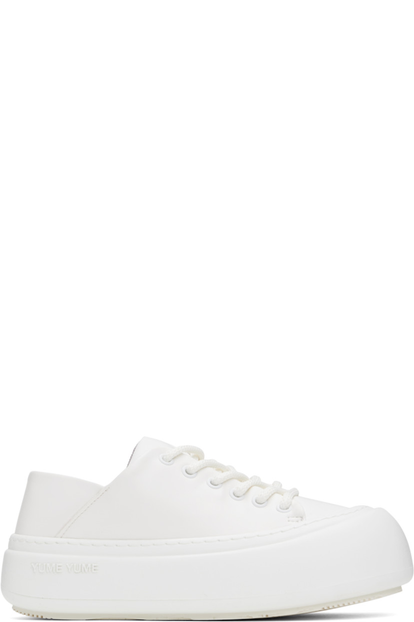Low-top buffed faux-leather sneakers in white.

· Lace-up closure
· Padded tongue and collar
· Logo stamp at padded footbed
· Mesh and faux-nubuck lining
· Topstitching at welt
· Logo embossed at rubber platform midsole
· Treaded rubber sole
· Platform: H2"

Supplier color: White