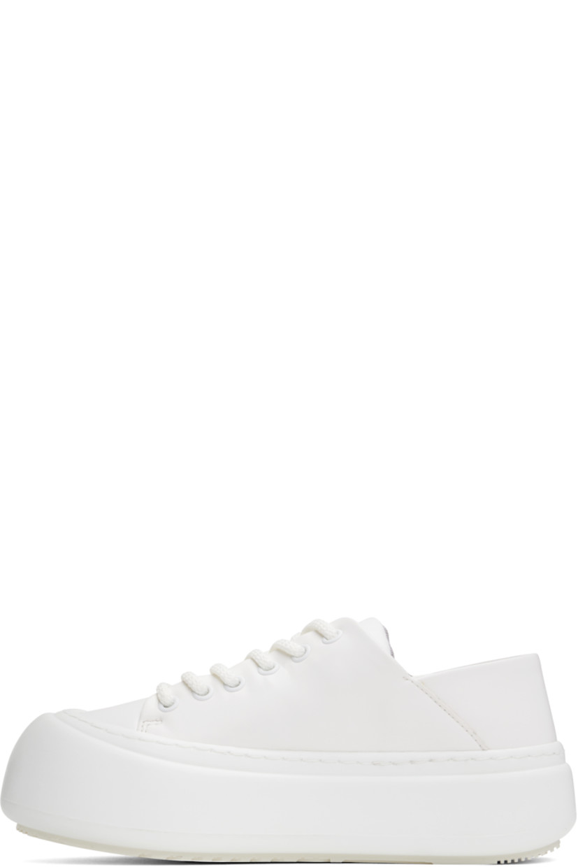 Low-top buffed faux-leather sneakers in white.

· Lace-up closure
· Padded tongue and collar
· Logo stamp at padded footbed
· Mesh and faux-nubuck lining
· Topstitching at welt
· Logo embossed at rubber platform midsole
· Treaded rubber sole
· Platform: H2"

Supplier color: White