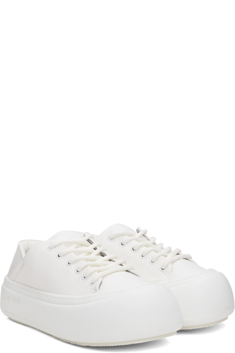 Low-top buffed faux-leather sneakers in white.

· Lace-up closure
· Padded tongue and collar
· Logo stamp at padded footbed
· Mesh and faux-nubuck lining
· Topstitching at welt
· Logo embossed at rubber platform midsole
· Treaded rubber sole
· Platform: H2"

Supplier color: White