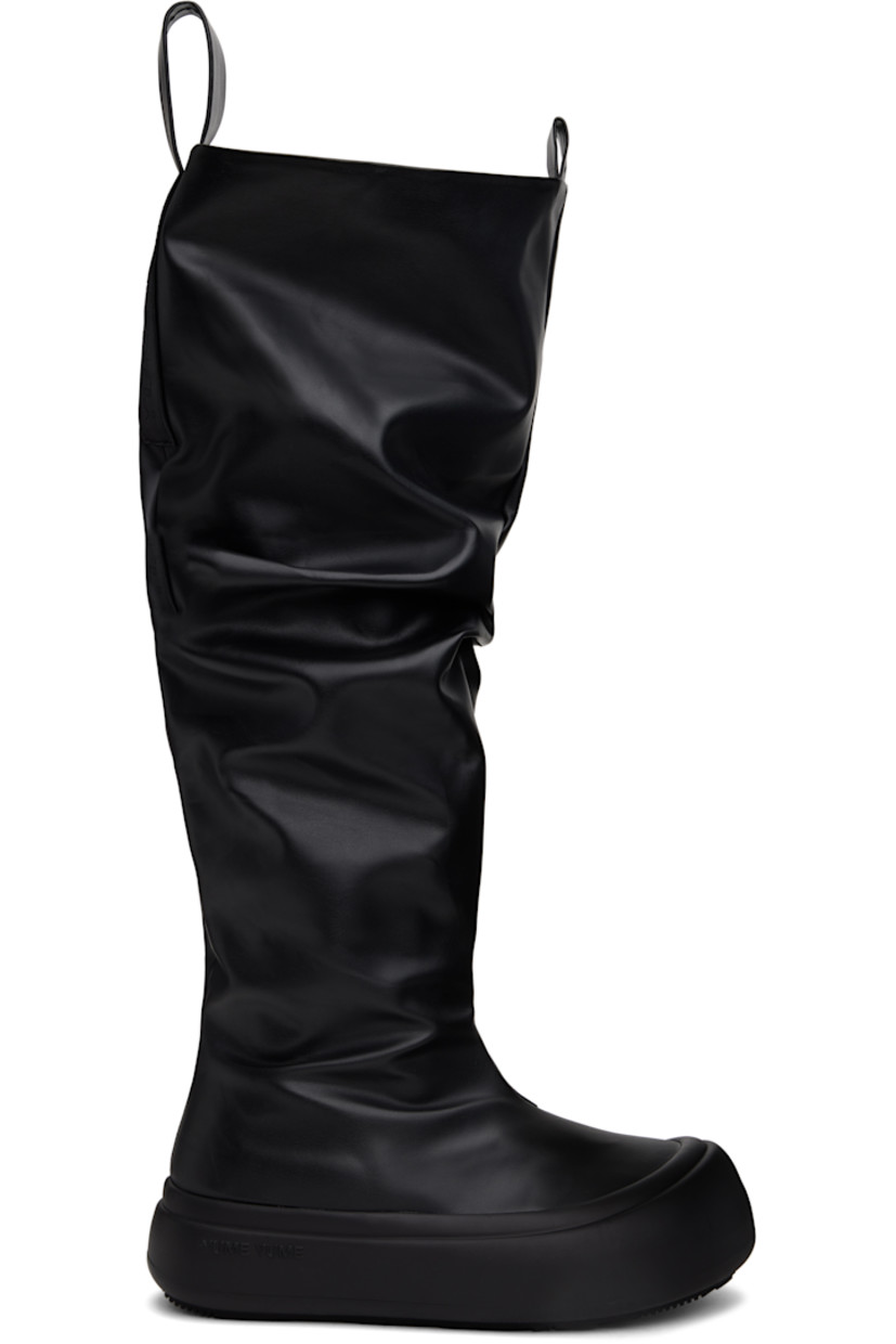 Knee-high buffed faux-leather boots in black.

· Gathering throughout
· Rubber cap toe
· Logo-embossed pull-loops at collar
· Padded footbed
· Grained faux-leather lining
· Logo-embossed rubber platform midsole
· Treaded rubber sole
· Platform: H1.75"

Supplier color: Black