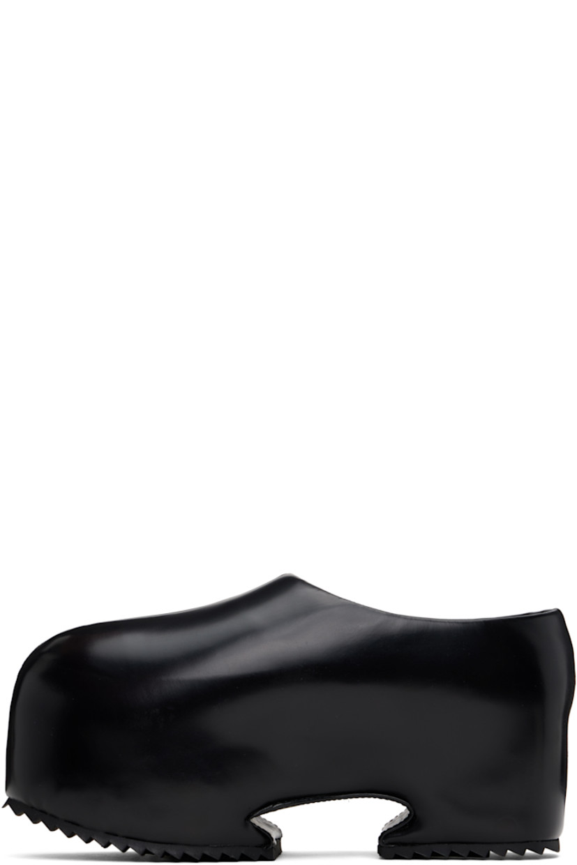 Buffed recycled leather-blend slip-on loafers in black.

· Pointed toe
· Logo embossed at padded footbed
· Cutout at covered platform midsole
· Treaded rubber sole
· Platform: H3"

Supplier color: Shiny black