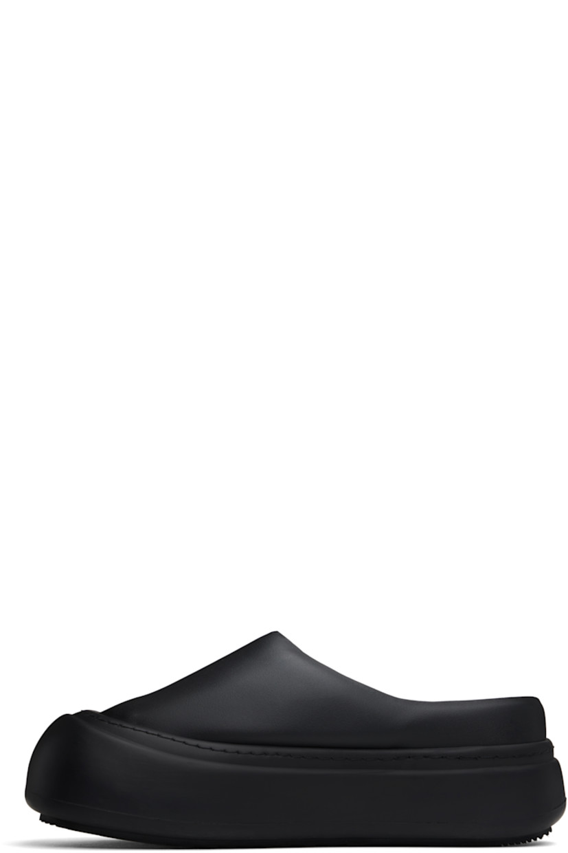 Padded buffed faux-leather slip-on loafers in black. 

· Rubber cap toe
· Logo stamp at molded footbed
· Grained faux-leather lining
· Logo-embossed rubber platform midsole
· Treaded rubber sole
· Platform: H2"

Supplier color: Black