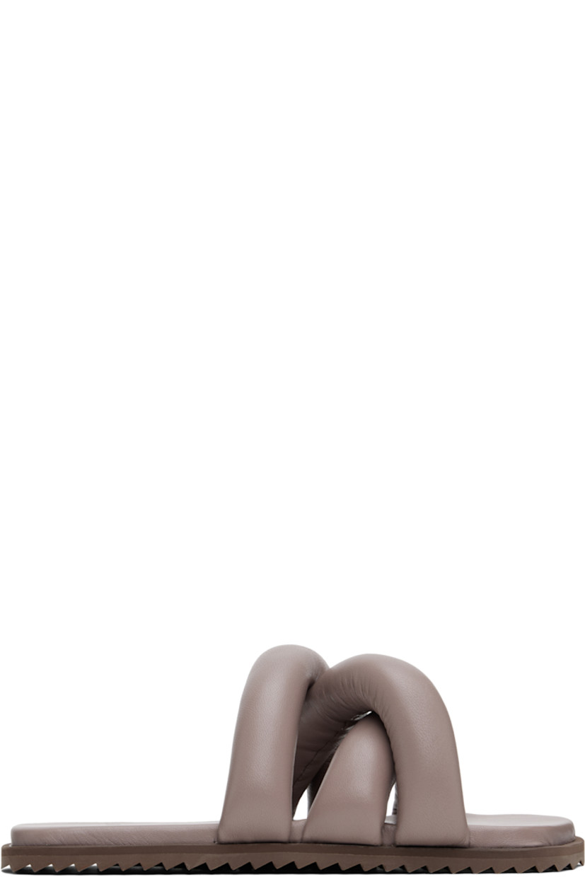 Padded buffed leather slip-on sandals in taupe.

· Open square toe
· Crisscrossing straps at vamp
· Logo embossed at padded buffed faux-leather footbed
· Treaded rubber sole

Supplier color: Castor