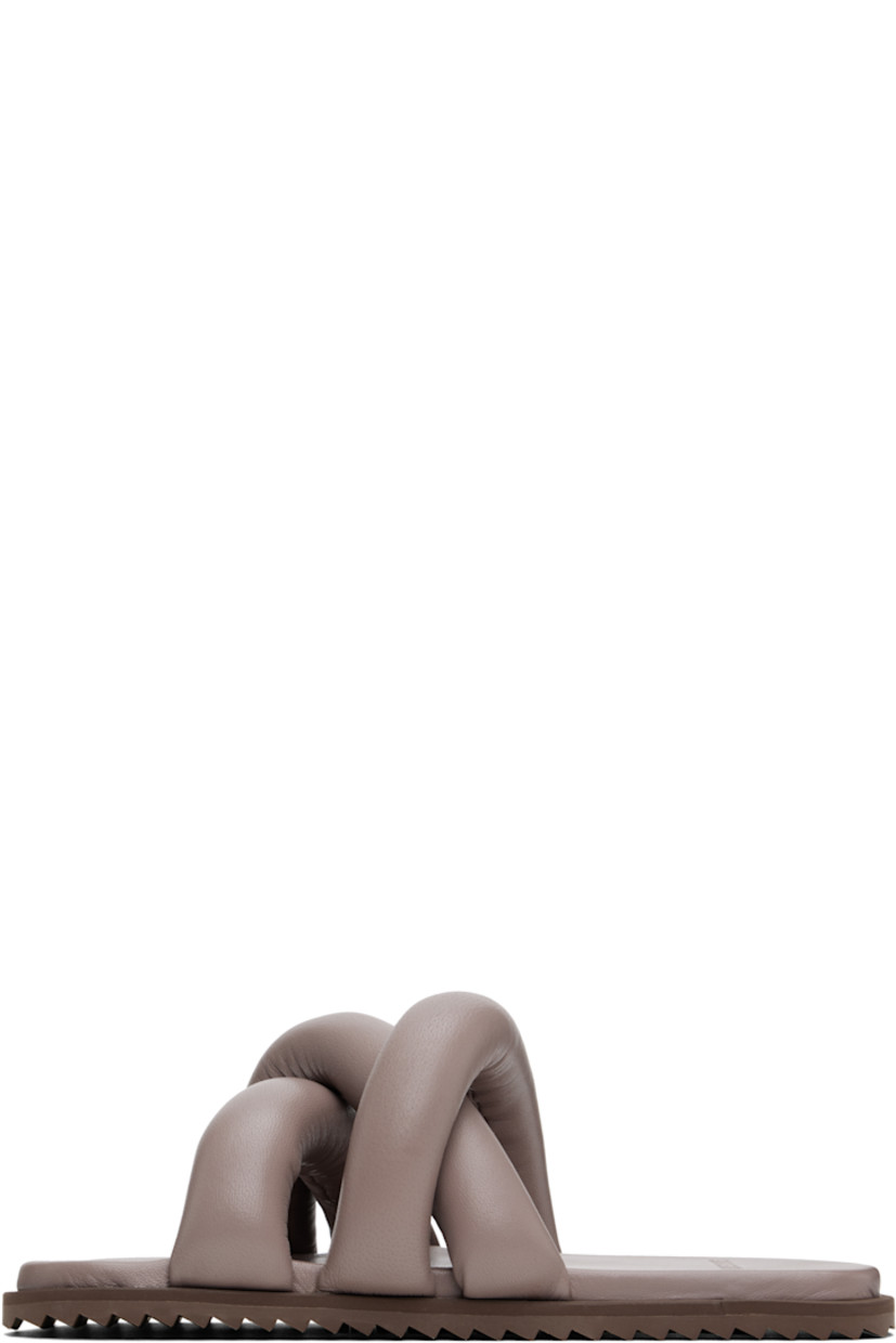 Padded buffed leather slip-on sandals in taupe.

· Open square toe
· Crisscrossing straps at vamp
· Logo embossed at padded buffed faux-leather footbed
· Treaded rubber sole

Supplier color: Castor