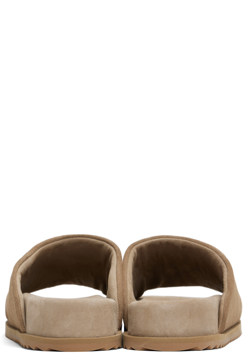 Faux-suede slip-on sandals in beige.

· Open square toe
· Logo embossed at padded faux-suede footbed
· Faux-suede lining
· Treaded rubber sole

Supplier color: Cappuccino