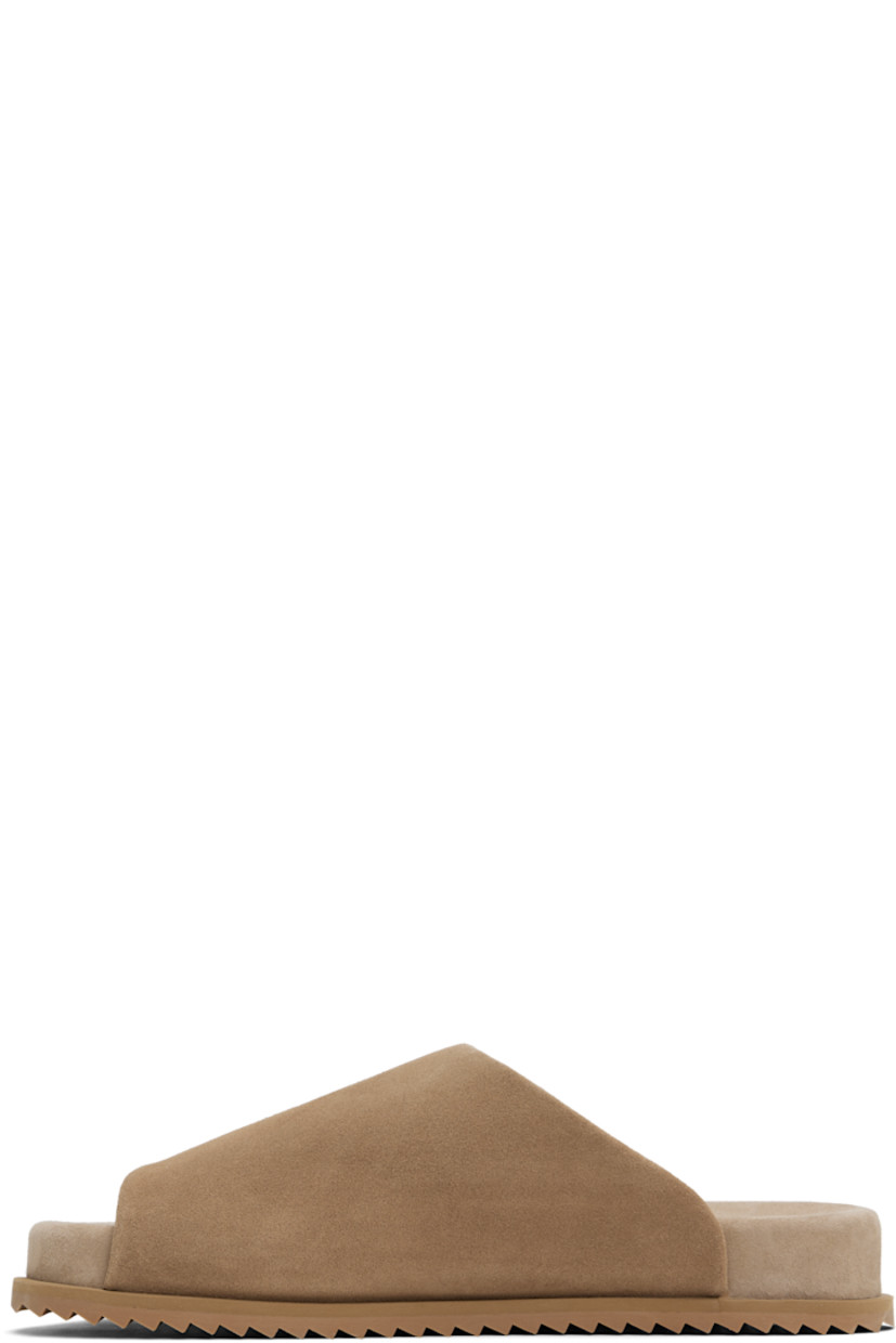 Faux-suede slip-on sandals in beige.

· Open square toe
· Logo embossed at padded faux-suede footbed
· Faux-suede lining
· Treaded rubber sole

Supplier color: Cappuccino