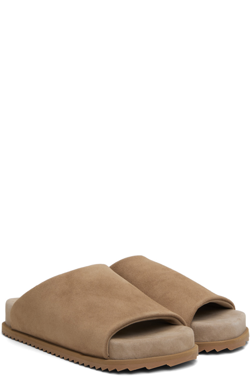 Faux-suede slip-on sandals in beige.

· Open square toe
· Logo embossed at padded faux-suede footbed
· Faux-suede lining
· Treaded rubber sole

Supplier color: Cappuccino