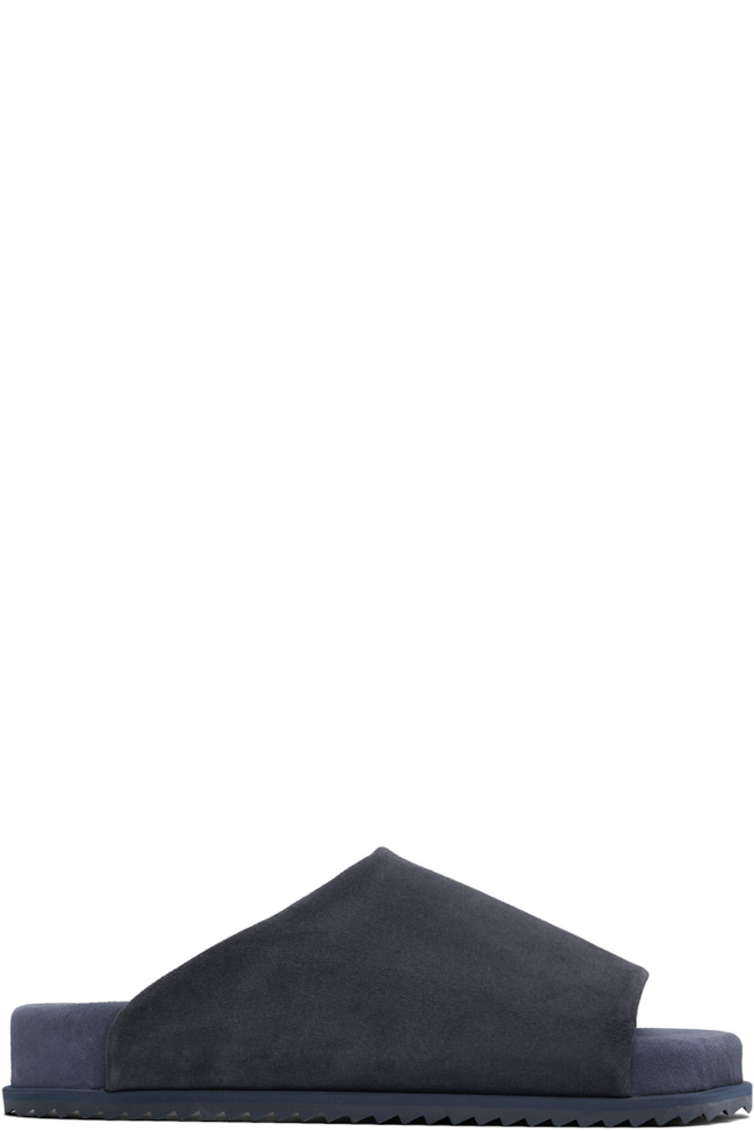 Faux-suede slip-on sandals in navy.

· Open square toe
· Logo embossed at padded faux-suede footbed
· Faux-suede lining
· Treaded rubber sole

Supplier color: Blue navy suede