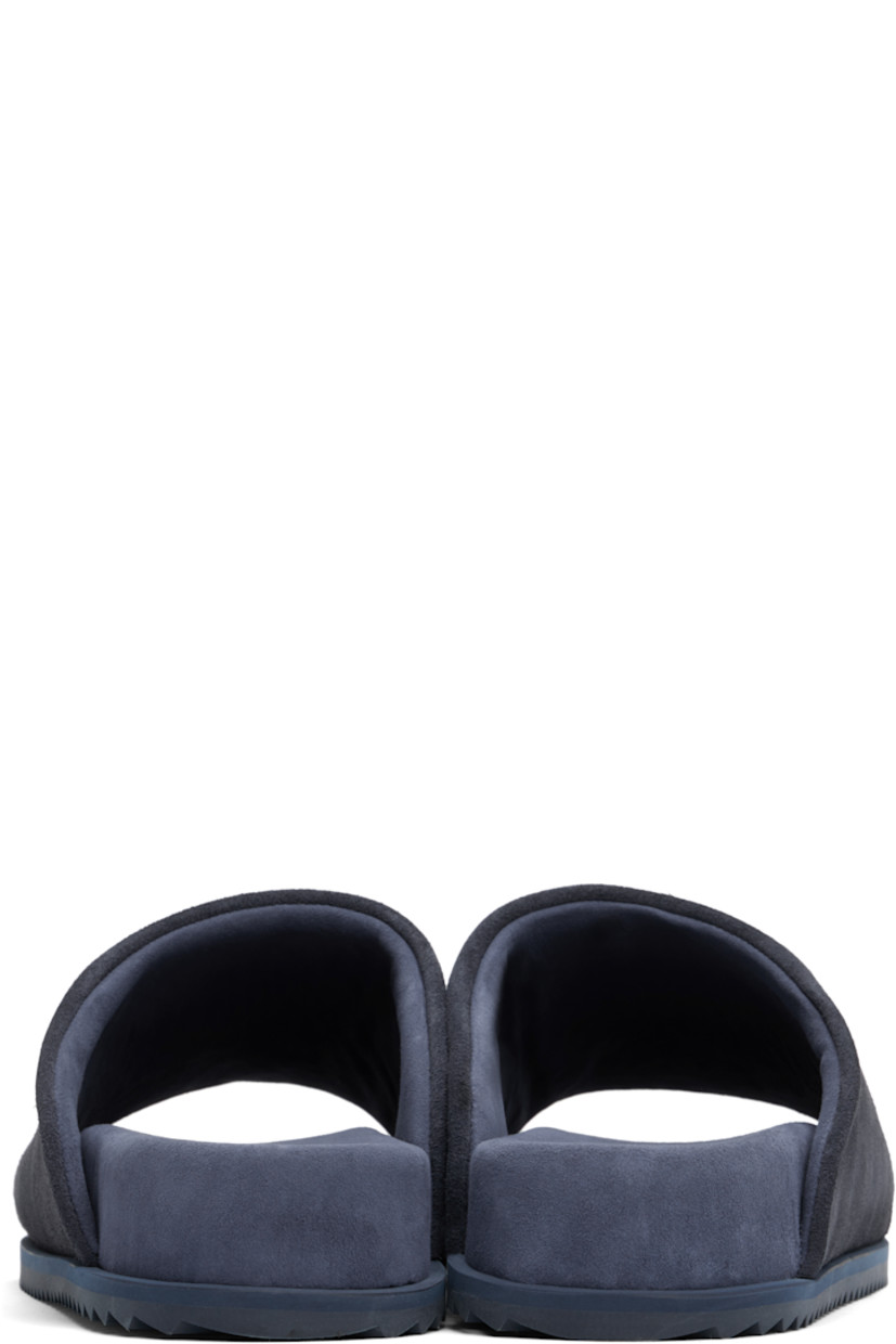 Faux-suede slip-on sandals in navy.

· Open square toe
· Logo embossed at padded faux-suede footbed
· Faux-suede lining
· Treaded rubber sole

Supplier color: Blue navy suede