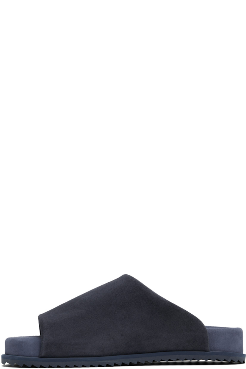 Faux-suede slip-on sandals in navy.

· Open square toe
· Logo embossed at padded faux-suede footbed
· Faux-suede lining
· Treaded rubber sole

Supplier color: Blue navy suede