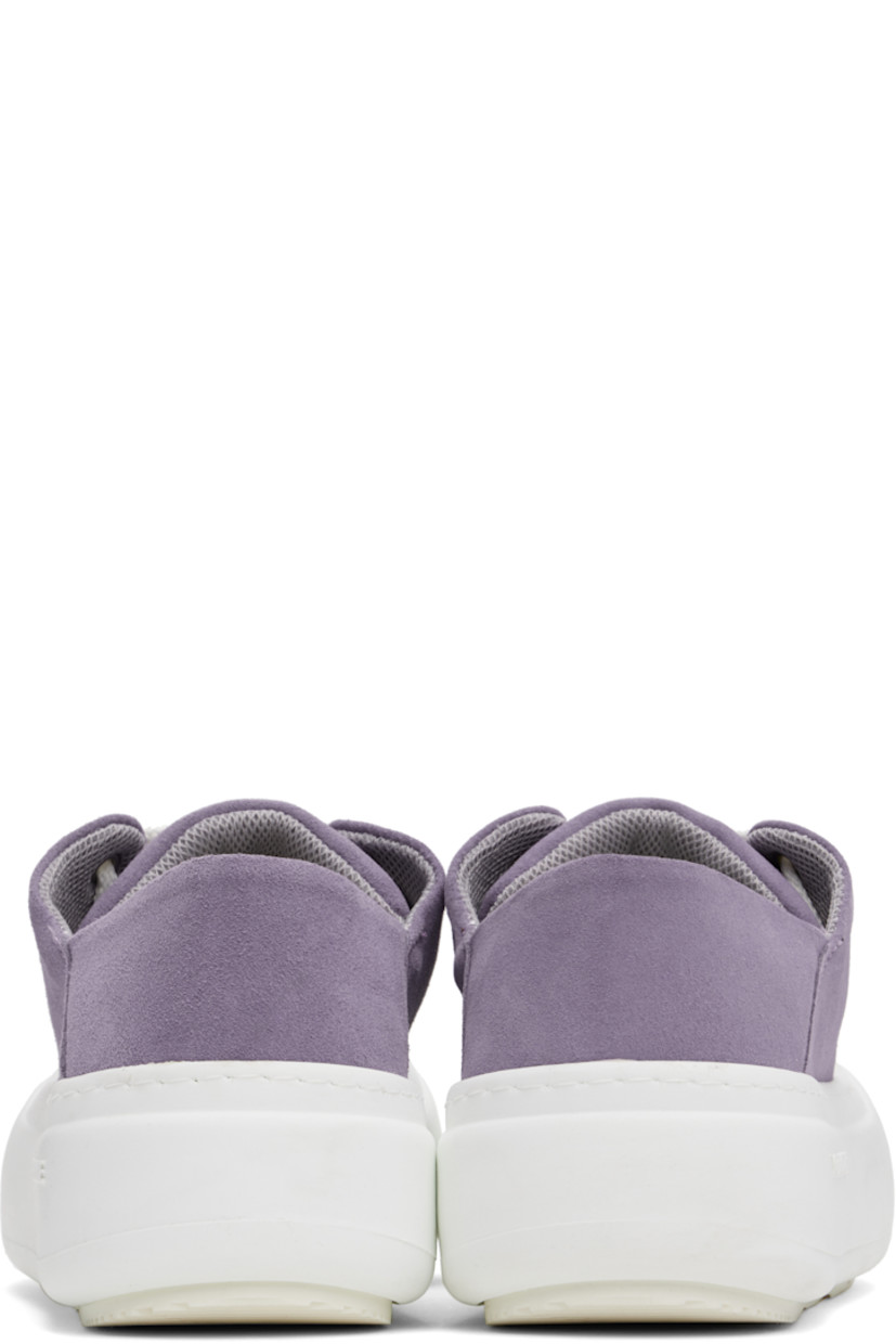 Low-top faux-suede sneakers in purple.

· Lace-up closure
· Padded tongue and collar
· Logo stamp at padded footbed
· Mesh and faux-nubuck lining
· Topstitching at welt
· Logo embossed at rubber platform midsole
· Treaded rubber sole
· Platform: H2"

Supplier color: Lila suede