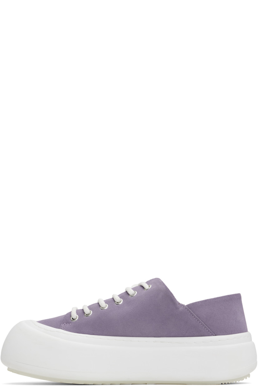 Low-top faux-suede sneakers in purple.

· Lace-up closure
· Padded tongue and collar
· Logo stamp at padded footbed
· Mesh and faux-nubuck lining
· Topstitching at welt
· Logo embossed at rubber platform midsole
· Treaded rubber sole
· Platform: H2"

Supplier color: Lila suede