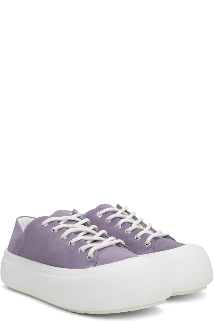 Low-top faux-suede sneakers in purple.

· Lace-up closure
· Padded tongue and collar
· Logo stamp at padded footbed
· Mesh and faux-nubuck lining
· Topstitching at welt
· Logo embossed at rubber platform midsole
· Treaded rubber sole
· Platform: H2"

Supplier color: Lila suede