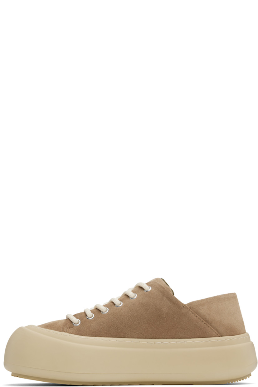 Low-top faux-suede sneakers in brown.

· Lace-up closure
· Padded tongue and collar
· Logo stamp at padded footbed
· Mesh and faux-nubuck lining
· Topstitching at welt
· Logo embossed at rubber platform midsole
· Treaded rubber sole
· Platform: H2"

Supplier color: Cappuccino suede