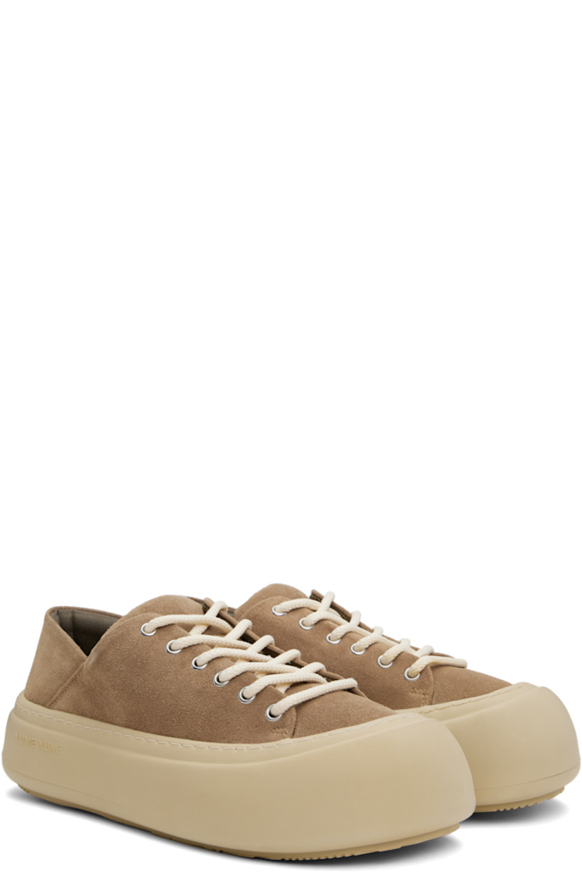 Low-top faux-suede sneakers in brown.

· Lace-up closure
· Padded tongue and collar
· Logo stamp at padded footbed
· Mesh and faux-nubuck lining
· Topstitching at welt
· Logo embossed at rubber platform midsole
· Treaded rubber sole
· Platform: H2"

Supplier color: Cappuccino suede