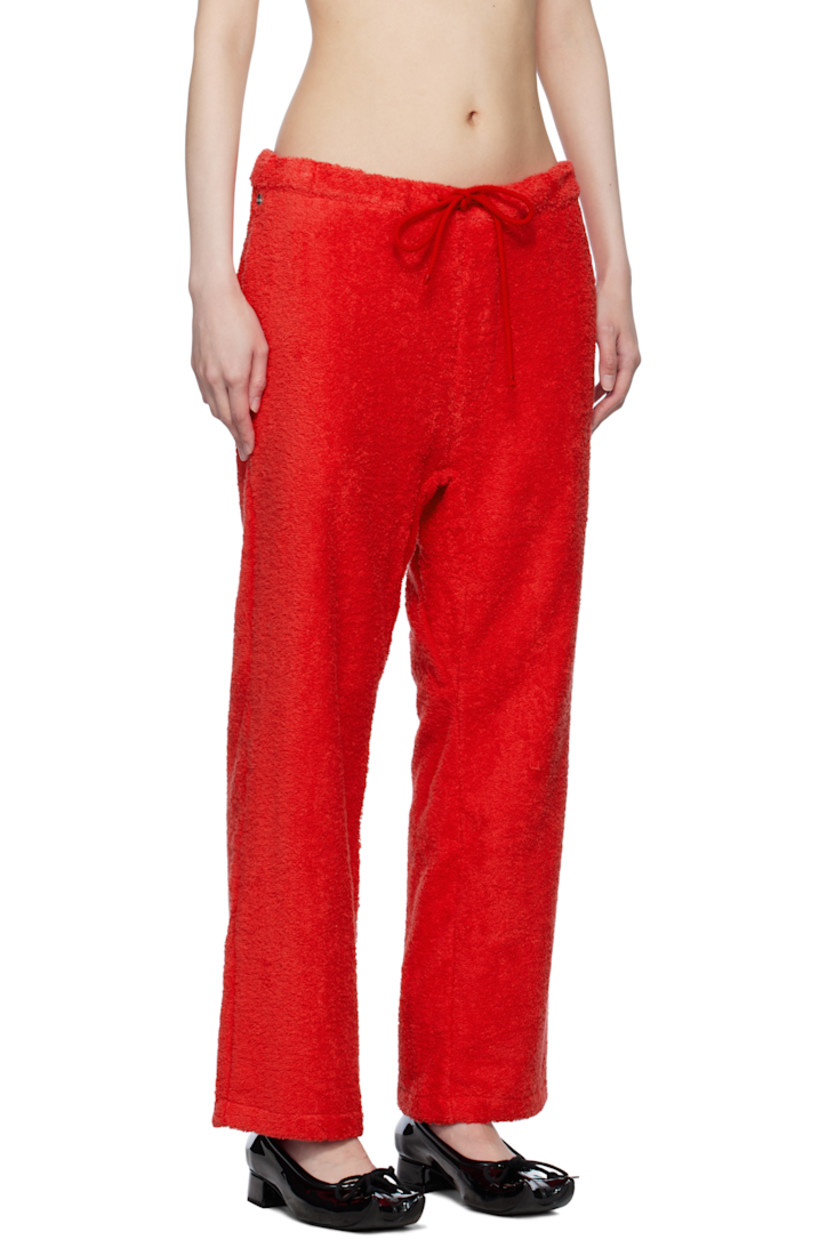 Cotton terrycloth lounge pants.

· Drawstring at waistband
· Logo hardware at front waistband
· Two-pocket styling

Supplier color: Terrycloth red