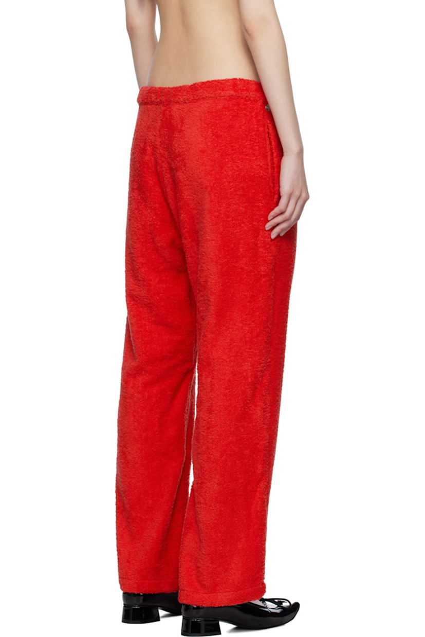 Cotton terrycloth lounge pants.

· Drawstring at waistband
· Logo hardware at front waistband
· Two-pocket styling

Supplier color: Terrycloth red