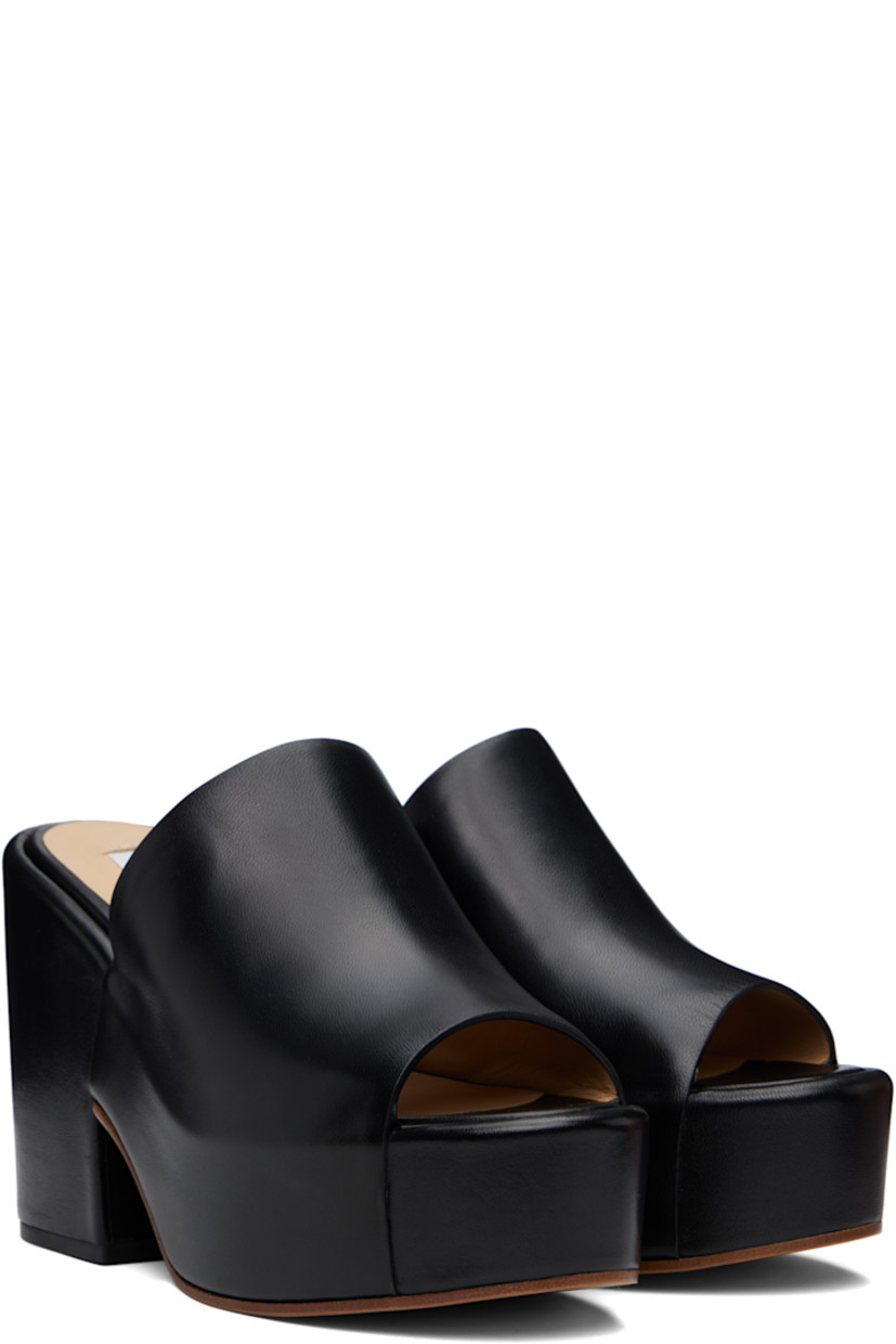 Nappa lambskin mules in black.

· Open toe
· Strap at vamp
· Covered platform midsole and block heel
· Polished calfskin sole with rubber injection
· Platform: H1.75"
· Heel: H4.25"

Supplier color: Black