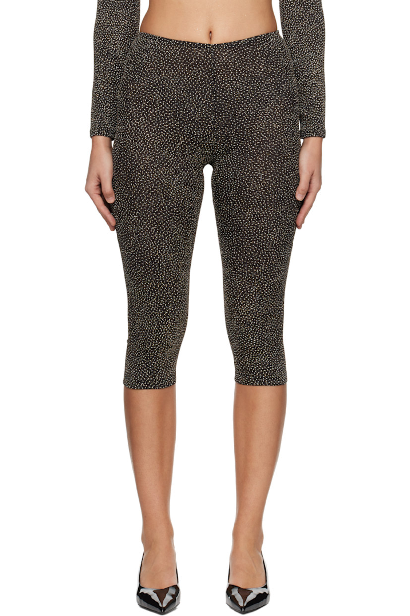 Semi-sheer plain-woven stretch nylon-blend leggings. Metallic thread detailing throughout.

· Elasticized waistband 
· Cropped leg

Supplier color: Black/Gold