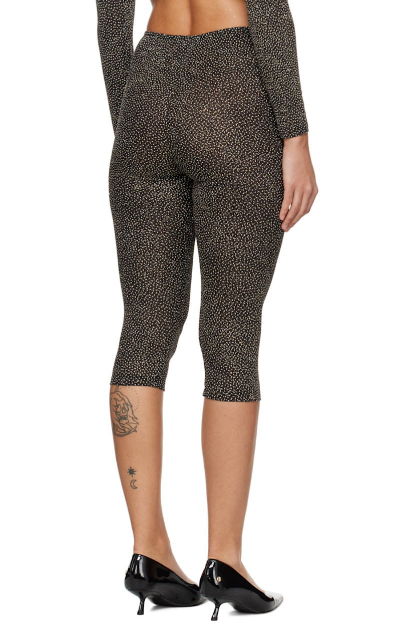 Semi-sheer plain-woven stretch nylon-blend leggings. Metallic thread detailing throughout.

· Elasticized waistband 
· Cropped leg

Supplier color: Black/Gold