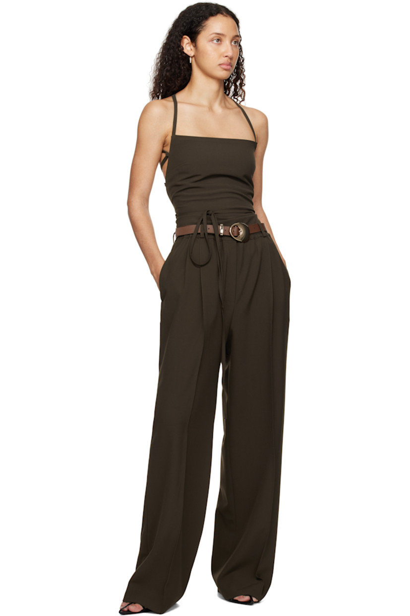 Plain-woven stretch polyester- and viscose-blend trousers.

· Belt loops at elasticized waistband
· Four-pocket styling
· Zip-fly
· Pleats at front
· Creased legs

Supplier color: Dark khaki