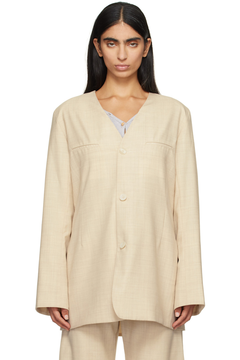 Yarn-dyed wool twill blazer.

· Y-neck 
· Button closure
· Welt pockets
· Darts at front
· Single-button surgeon's cuffs
· Central seam and vent at back

Supplier color: Ecru melange