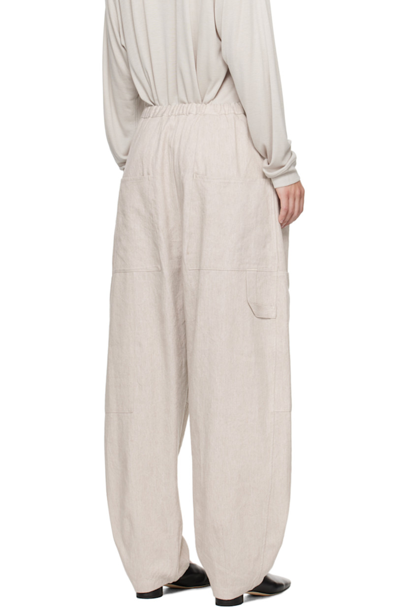 Linen- and cotton-blend twill trousers.

· Concealed drawstring at elasticized waistband
· Four-pocket styling
· Zip-fly
· Patch pocket at knees
· Patch pocket and hammer loop at outseam

Supplier color: Plaster