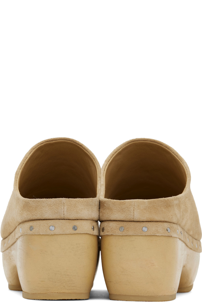 Handcrafted suede slip-on loafers in beige. 

· Logo embossed at padded footbed
· Grained leather lining
· Rivets at welt
· Hand-painted wood block heel and platform midsole
· Crepe rubber sole
· Platform: H1"
· Heel: H2.75"

Supplier color: Sand