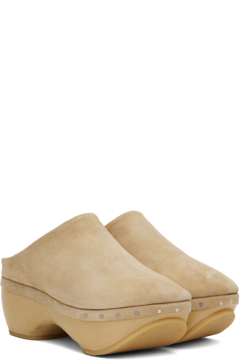 Handcrafted suede slip-on loafers in beige. 

· Logo embossed at padded footbed
· Grained leather lining
· Rivets at welt
· Hand-painted wood block heel and platform midsole
· Crepe rubber sole
· Platform: H1"
· Heel: H2.75"

Supplier color: Sand