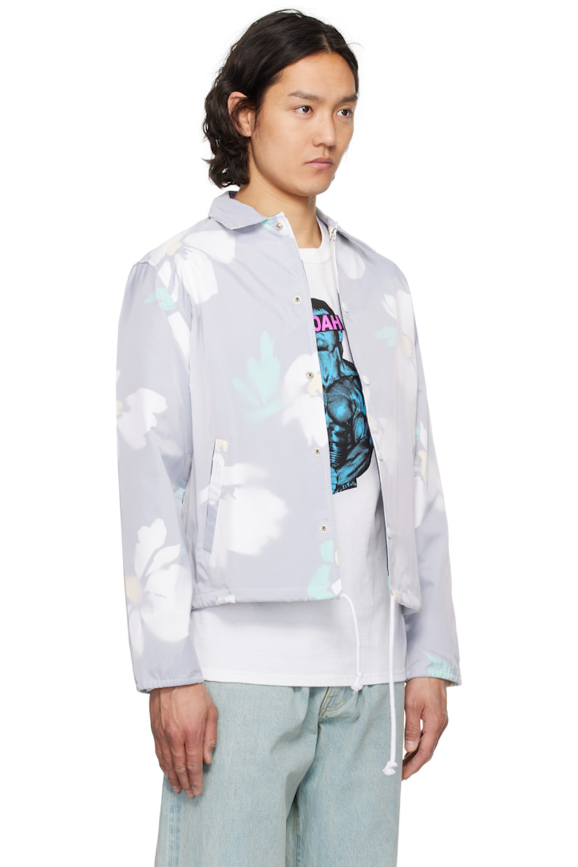 Nylon taffeta jacket. Floral pattern printed throughout.

· Spread collar
· Press-stud closure
· Welt pockets
· Drawstring at hem
· Eyelets at underarms
· Elasticized cuffs
· Logo embroidered at cuff
· Full cotton broken twill lining

Supplier color: White/Multi