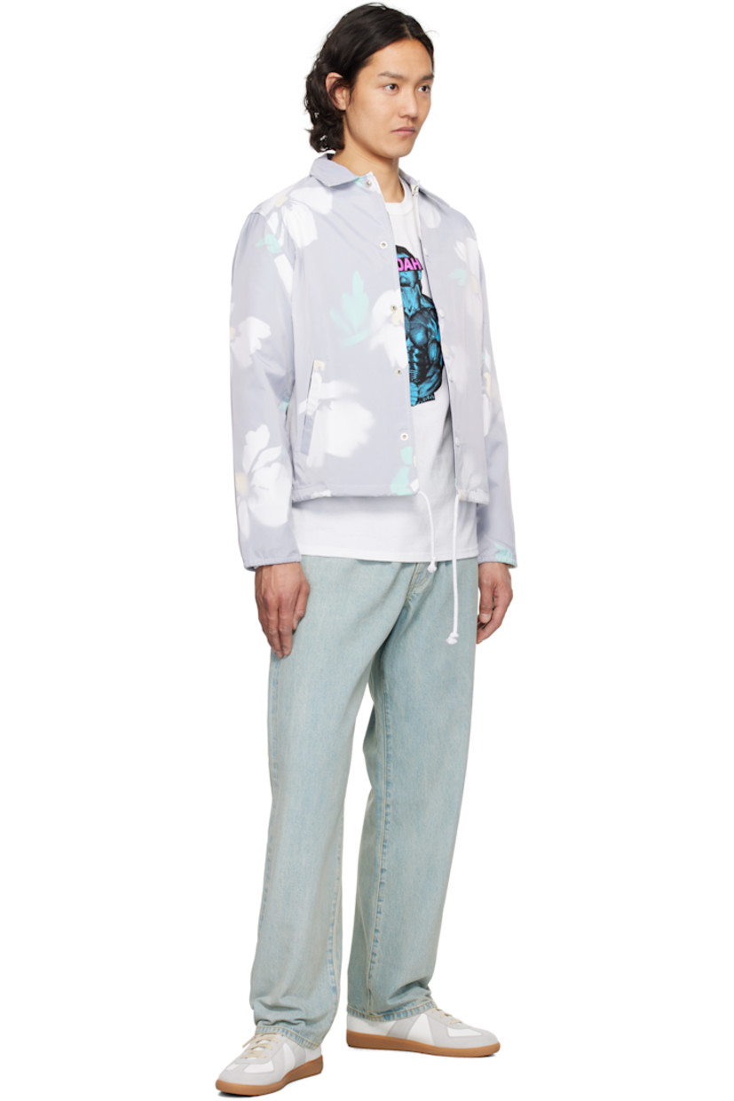 Nylon taffeta jacket. Floral pattern printed throughout.

· Spread collar
· Press-stud closure
· Welt pockets
· Drawstring at hem
· Eyelets at underarms
· Elasticized cuffs
· Logo embroidered at cuff
· Full cotton broken twill lining

Supplier color: White/Multi