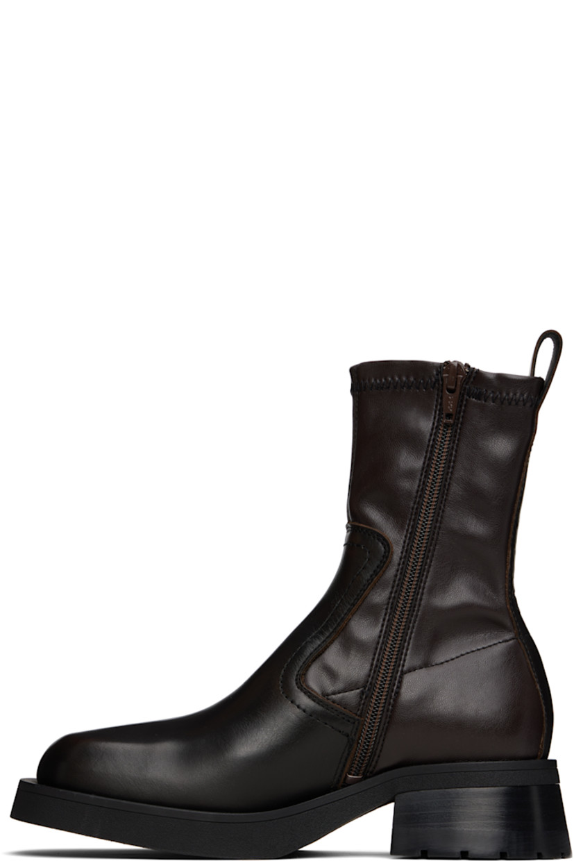 Ankle-high grained leather and faux-leather boots.

· Square toe 
· Rubberized logo flag at vamp
· Zip closure at inner side
· Pull-loop at collar 
· Stacked leather block heel with rubber injection
· Rubber sole
· Heel: H2"

Supplier color: Brown