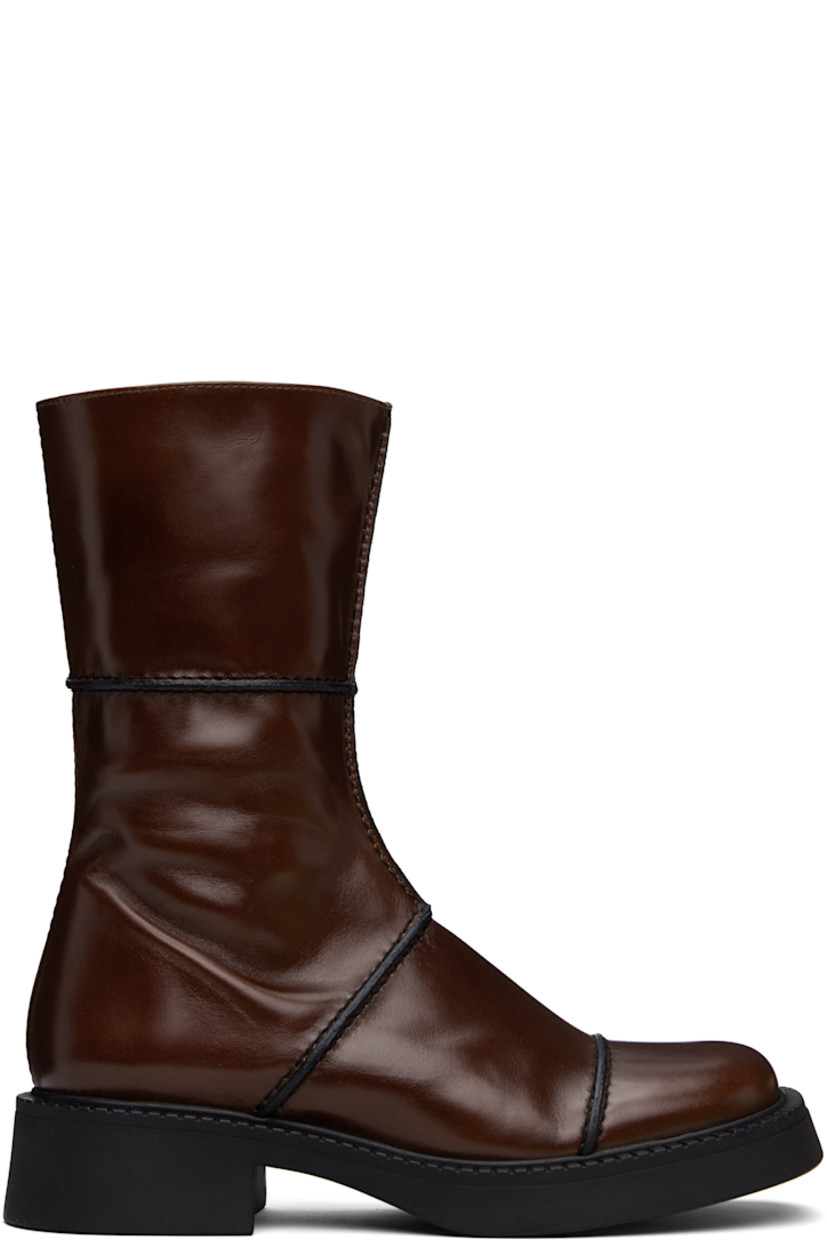 Handcrafted mid-calf polished leather boots in brown.

· Pinched seams in black throughout
· Paneled construction
· Square toe
· Concealed elasticized gusset at collar
· Zip closure at inner side
· Rubber block heel
· Grained faux-leather lining
· Treaded rubber sole
· Heel: H1.5"

Supplier color: Brown