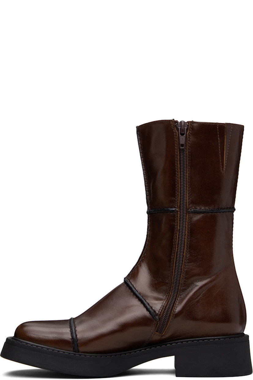 Handcrafted mid-calf polished leather boots in brown.

· Pinched seams in black throughout
· Paneled construction
· Square toe
· Concealed elasticized gusset at collar
· Zip closure at inner side
· Rubber block heel
· Grained faux-leather lining
· Treaded rubber sole
· Heel: H1.5"

Supplier color: Brown