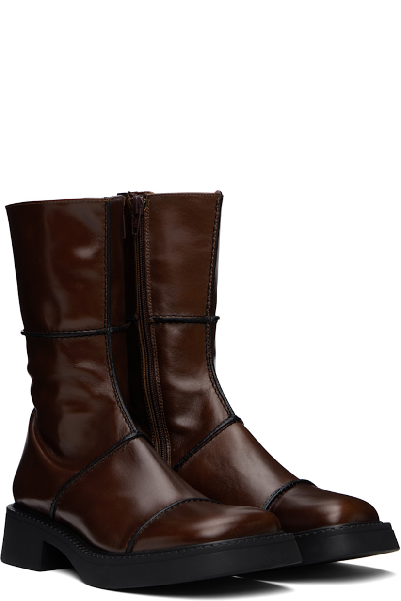 Handcrafted mid-calf polished leather boots in brown.

· Pinched seams in black throughout
· Paneled construction
· Square toe
· Concealed elasticized gusset at collar
· Zip closure at inner side
· Rubber block heel
· Grained faux-leather lining
· Treaded rubber sole
· Heel: H1.5"

Supplier color: Brown