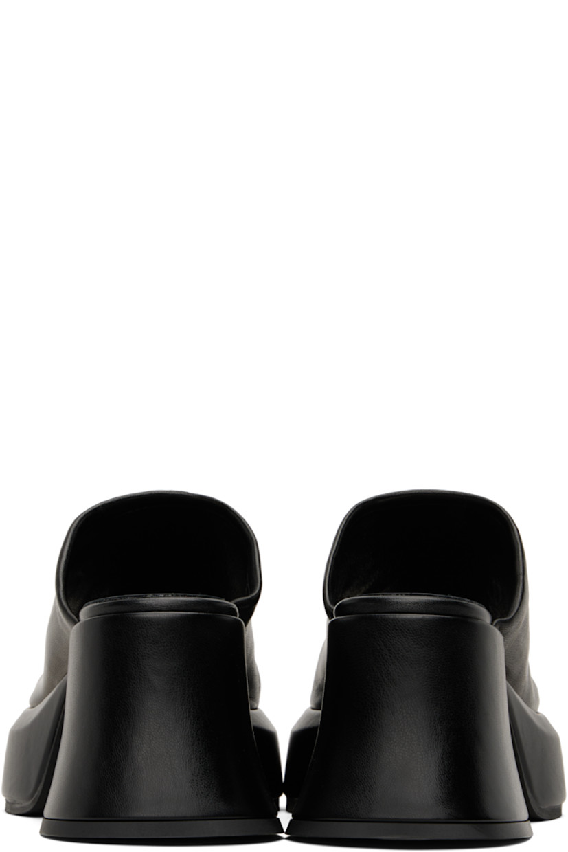 Grained leather slip-on heeled sandals in black.

· Open toe
· Logo stamp at memory foam footbed
· Covered block heel and platform midsole
· Rubber sole
· Platform: H1.75"
· Heel: H3"

Supplier color: Black