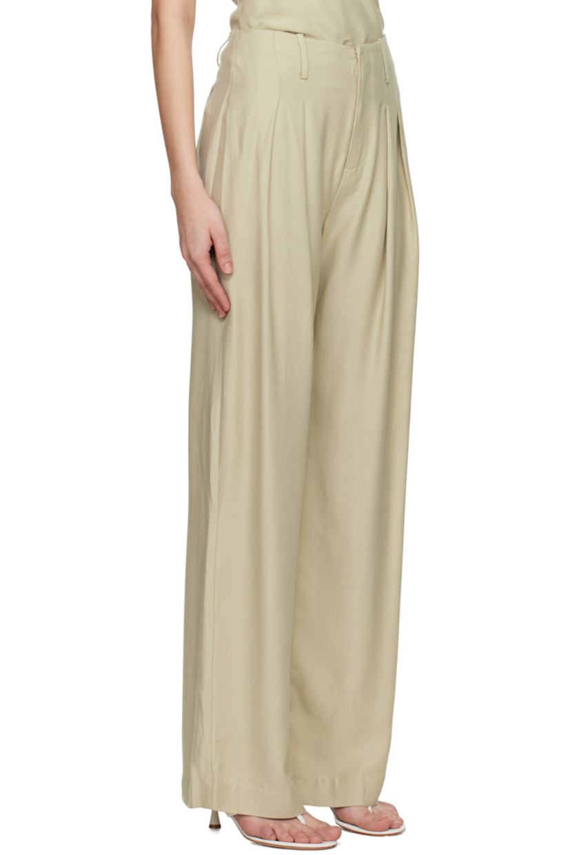 Loose-fit and straight-leg TENCEL™- and nylon-blend twill trousers. 

· High-rise
· Belt loops 
· Two-pocket styling
· Zip fly
· Pleats at front 

Supplier color: Pumice