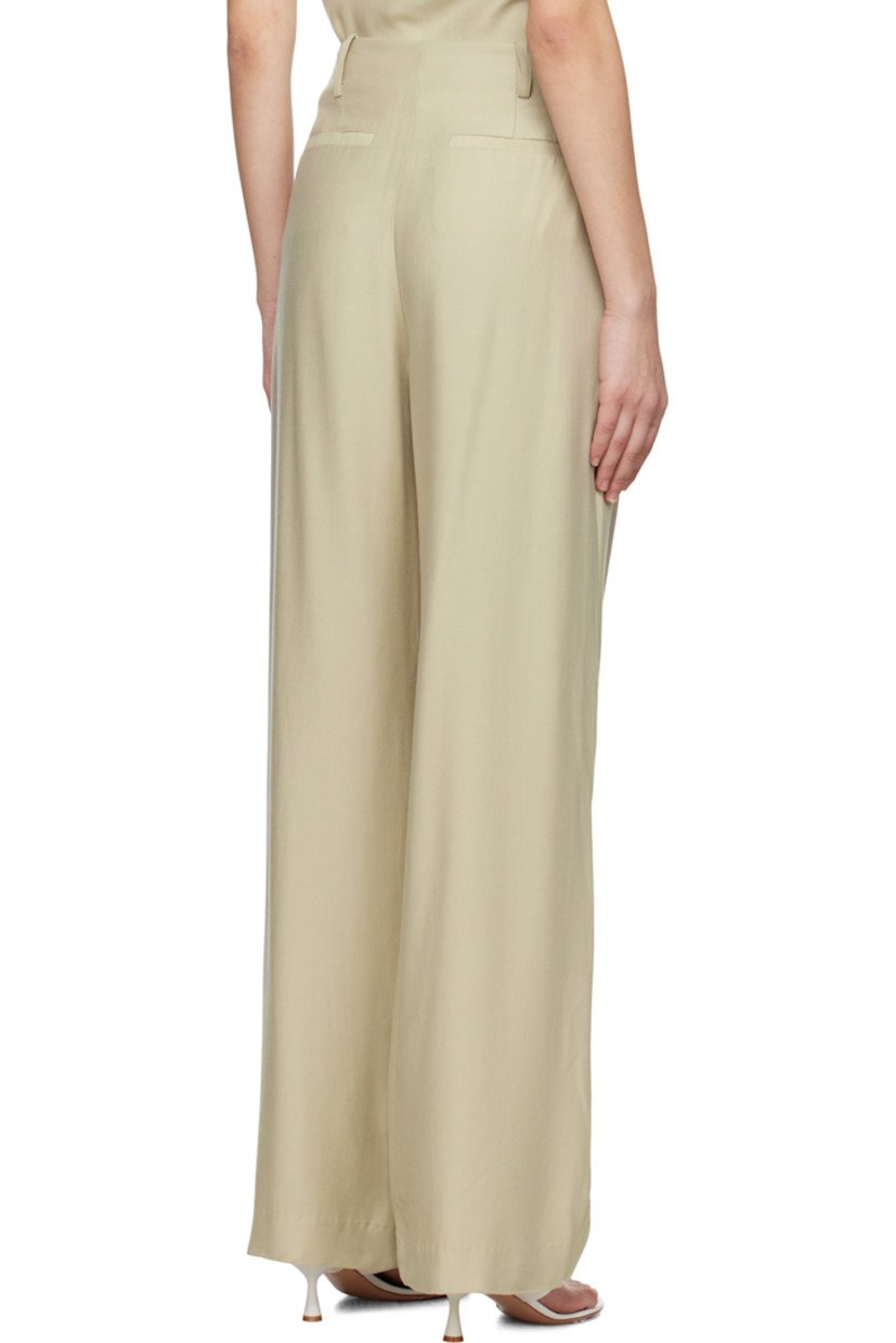 Loose-fit and straight-leg TENCEL™- and nylon-blend twill trousers. 

· High-rise
· Belt loops 
· Two-pocket styling
· Zip fly
· Pleats at front 

Supplier color: Pumice
