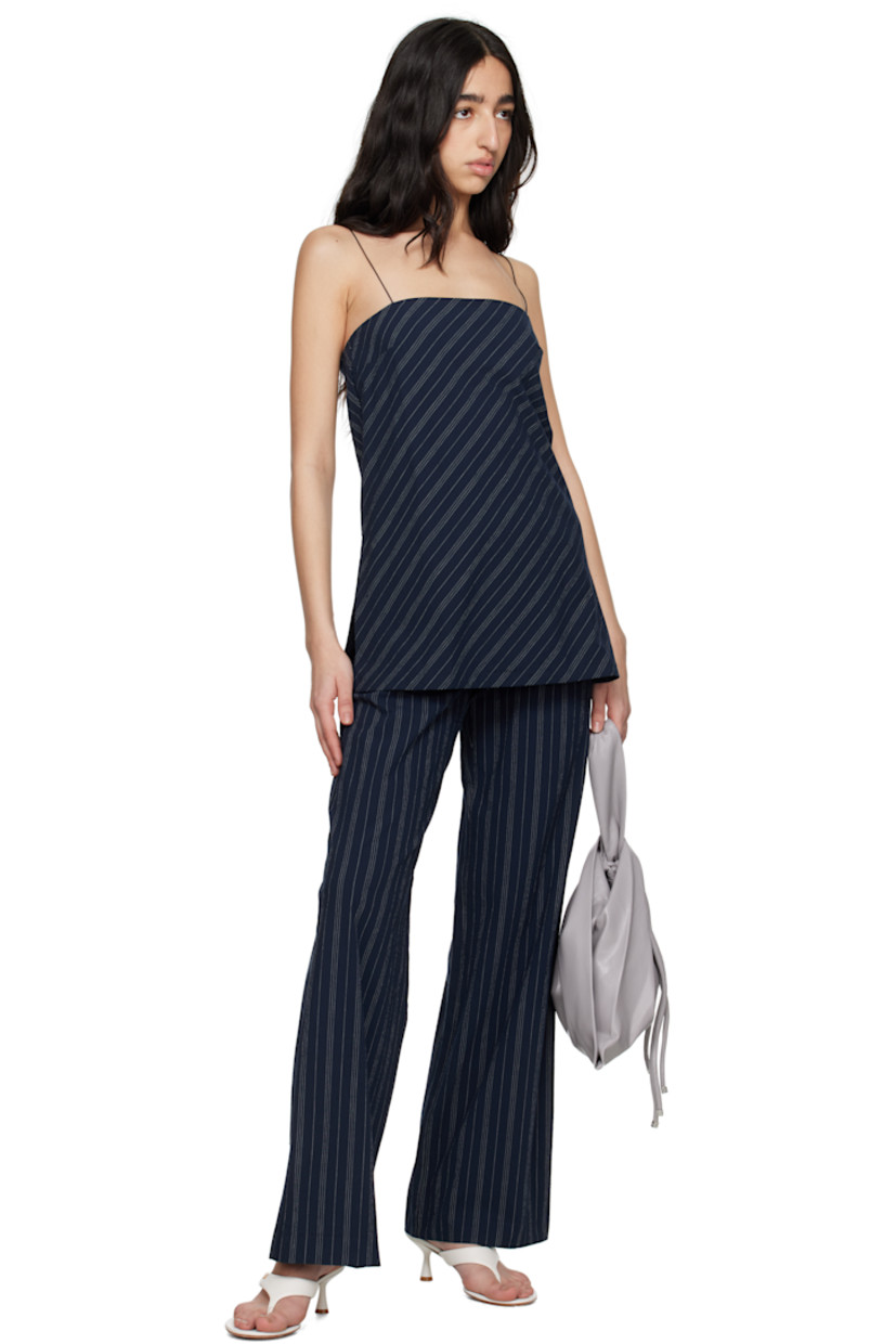 Stretch cotton seersucker top. Stripes throughout. 

· Straight neck
· Darts at chest
· Vented side seams 
· Concealed zip closure at side
· Fixed spaghetti straps
· Tucks at back 
· Integrated bra-style underlay with elasticized hem

Supplier color: Ink/Ivory stripe