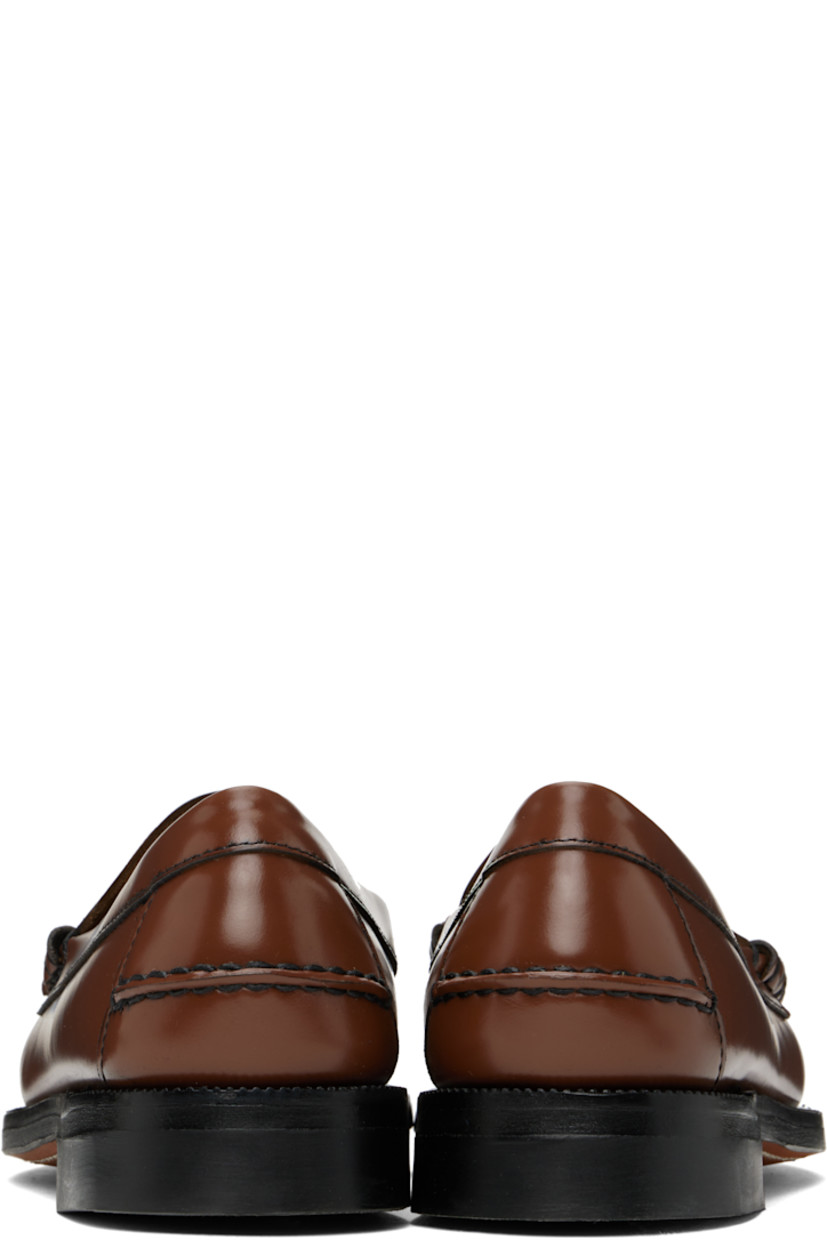 Handcrafted buffed leather loafers in brown.

· Moc toe
· Strap with cutout at vamp
· Pinched seam at heel counter
· Molded footbed
· Serrated edge at welt
· Rubber block heel
· Leather sole

Part of the Citysides collection.

Supplier color: Brown