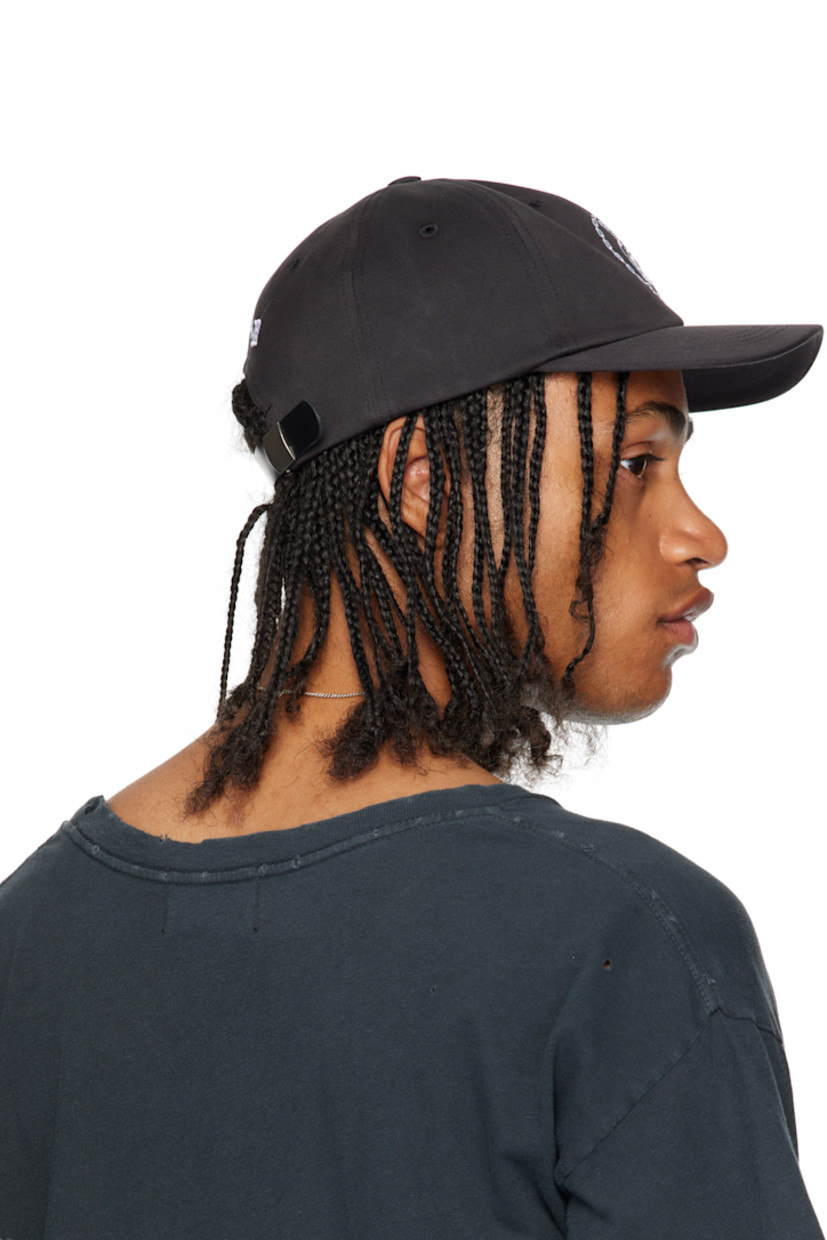 Cotton twill cap.

· Embroidered eyelets at crown
· Graphic embroidered at face and back face
· Leather cinch strap at back face
· Partial plain-woven cotton lining

Supplier color: Black/White