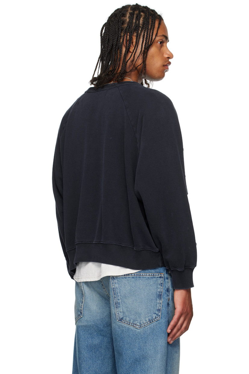 French terry sweatshirt.

· Distressing throughout
· Rib-knit crewneck, hem, and cuffs
· Graphic printed at chest
· Raglan sleeves

Supplier color: Faded purple