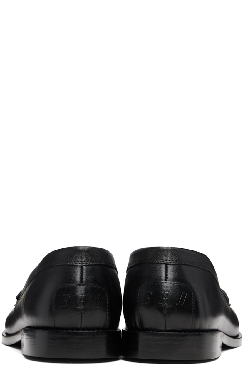 Buffed calfskin loafers.

· Moc toe
· Logo-embossed strap at vamp
· Logo embossed at heel counter
· Calfskin sole

Supplier color: Black