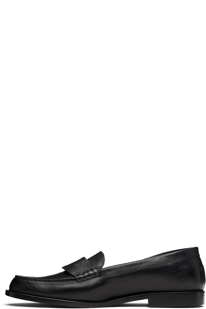 Buffed calfskin loafers.

· Moc toe
· Logo-embossed strap at vamp
· Logo embossed at heel counter
· Calfskin sole

Supplier color: Black